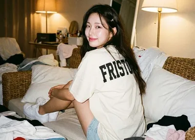 Girl sitting on a woven sofa with her back to the audience generated by AIGH AI Graphics Hub